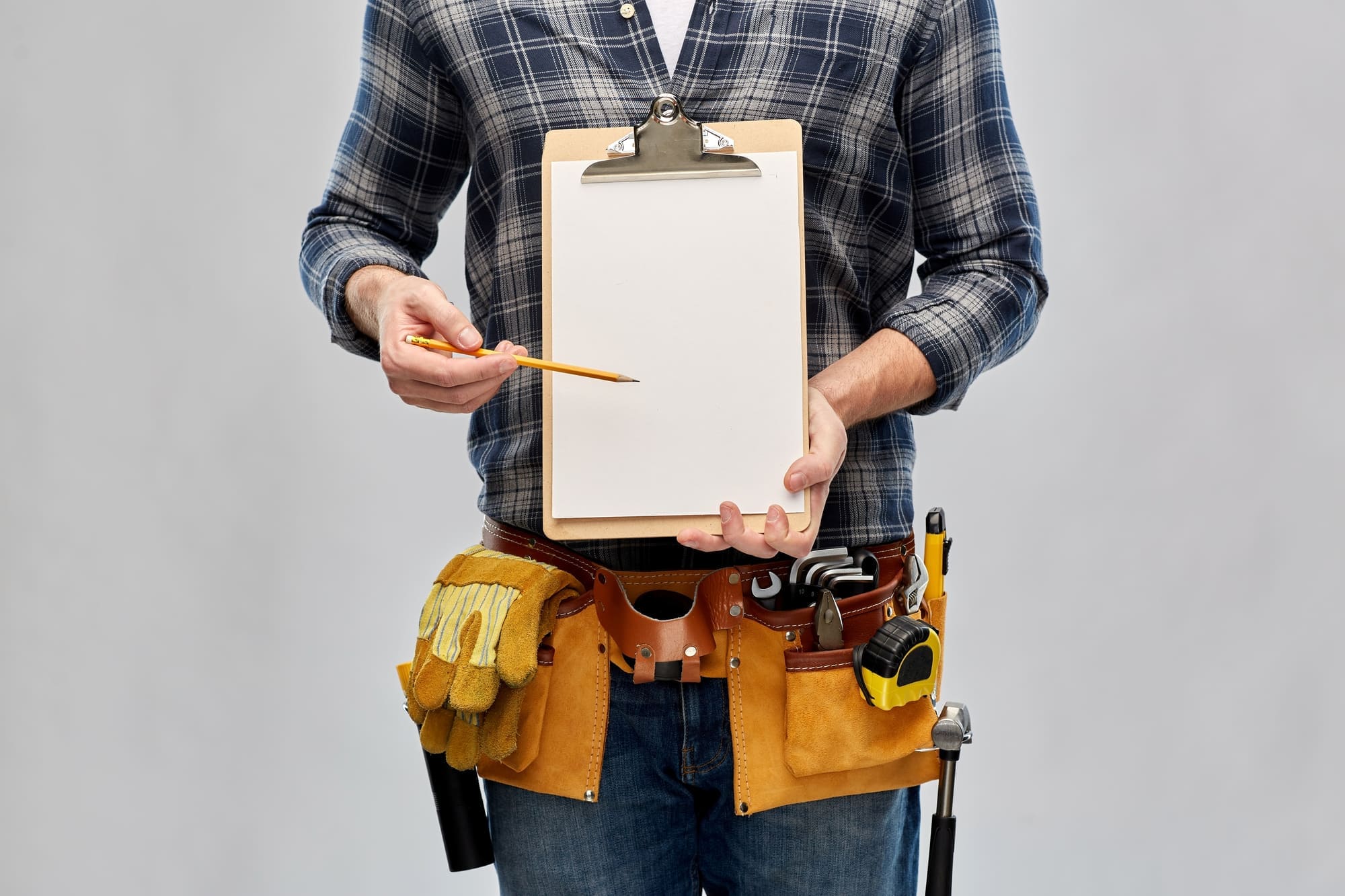 Construction worker reviewing project data on a tablet